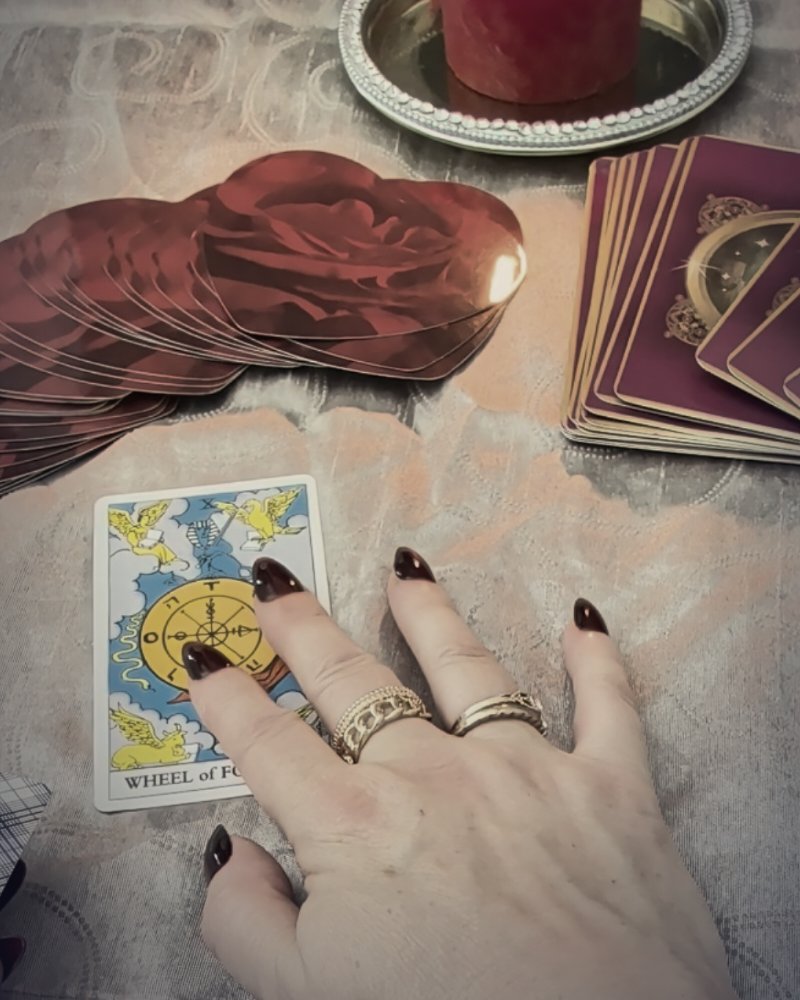Wheel of Fortune with roses and a candle